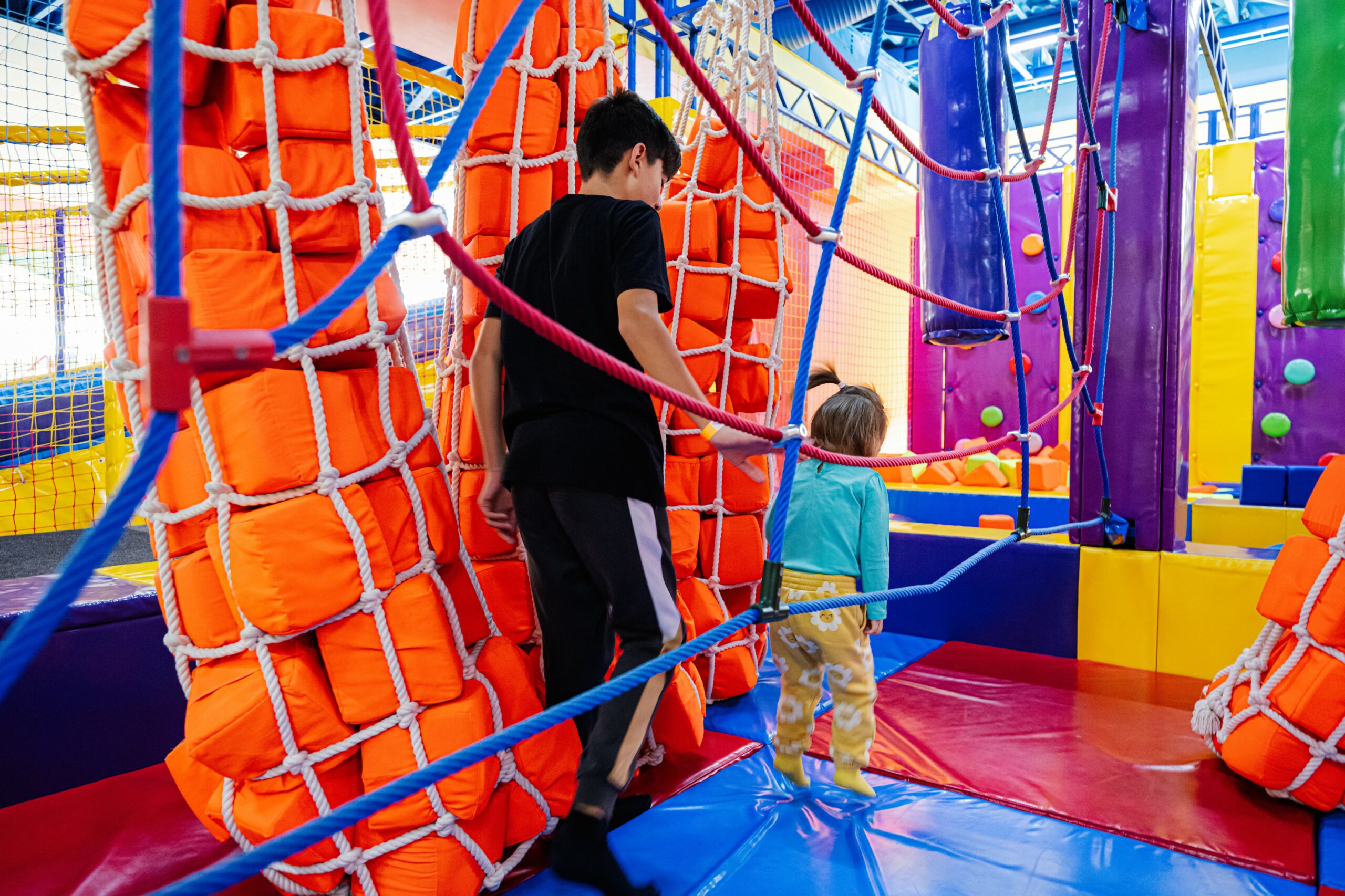 brother with sister playing at indoor play center 2023 11 27 05 36 43 utc (1)